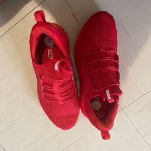 New red puma shoes, size 2